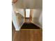 Staircase leading downstairs with brown wooden steps and handrail at 1455 Stone Mill Trce, Stone Mountain, GA 30083
