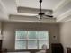 Bedroom featuring a ceiling fan and a large window overlooking the backyard at 1790 Nestledown Dr, Cumming, GA 30040