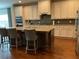 Spacious kitchen features granite countertops, stainless steel appliances, and a large island at 1790 Nestledown Dr, Cumming, GA 30040