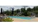 Enjoy the community pool with ample seating, landscaping, and black fencing for a luxury living experience at 1790 Nestledown Dr, Cumming, GA 30040
