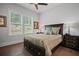 Comfortable bedroom with natural light and wood floors at 411 Oakleigh Ave, Woodstock, GA 30188