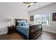 Inviting bedroom with a large window and classic decor and dark wood floors at 411 Oakleigh Ave, Woodstock, GA 30188
