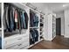 Walk-in closet featuring custom shelving and drawers at 411 Oakleigh Ave, Woodstock, GA 30188
