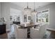 Bright dining room showcasing a wooden table, seating for six, and stylish lighting at 411 Oakleigh Ave, Woodstock, GA 30188