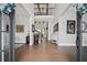 Grand foyer with soaring ceilings, hardwood floors, designer lighting and upscale decor at 411 Oakleigh Ave, Woodstock, GA 30188