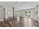 Finished basement area with recessed lighting, wood flooring, and access to the backyard through french doors at 4200 Sterling Pointe Dr, Douglasville, GA 30135