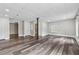 Spacious basement with wood flooring and neutral paint, offering potential for a versatile living area at 4200 Sterling Pointe Dr, Douglasville, GA 30135