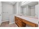 Bathroom showcasing a vanity, large mirror, and shower/tub combo at 4200 Sterling Pointe Dr, Douglasville, GA 30135