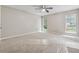 Bright bedroom features two windows, ceiling fan, and ample space at 4200 Sterling Pointe Dr, Douglasville, GA 30135