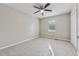 Spacious bedroom with carpeted floors, a ceiling fan, and natural light from a window at 4200 Sterling Pointe Dr, Douglasville, GA 30135