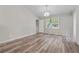 Bedroom features hardwood floors, chandelier, and natural light at 4200 Sterling Pointe Dr, Douglasville, GA 30135