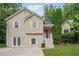 Charming two-story home with beige siding, white trim, and a well-maintained front lawn at 4200 Sterling Pointe Dr, Douglasville, GA 30135