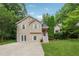 Two-story home with a manicured lawn and mature trees at 4200 Sterling Pointe Dr, Douglasville, GA 30135