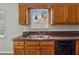 Kitchen sink with stainless steel appliances and wood cabinets at 4200 Sterling Pointe Dr, Douglasville, GA 30135