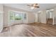 Bright and airy living room featuring wood-look floors, a bay window, and a fireplace at 4200 Sterling Pointe Dr, Douglasville, GA 30135