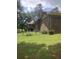 Brick home showing the backyard with a chain link fence at 1195 Christian Circle, Conyers, GA 30013