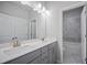 Bathroom featuring a double sink vanity with a large mirror and shower/tub at 1505 Slopeside Loop, Smyrna, GA 30082