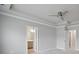 Open bedroom with tray ceilings and adjoining bathroom entrance at 1505 Slopeside Loop, Smyrna, GA 30082