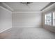 Spacious bedroom featuring neutral walls, plush carpeting, and a ceiling fan at 1505 Slopeside Loop, Smyrna, GA 30082