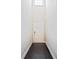 Bright foyer with dark hardwood floors leading to a white paneled door at 1505 Slopeside Loop, Smyrna, GA 30082