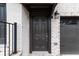 Close-up of front door with dark brown door and light brick facade at 1505 Slopeside Loop, Smyrna, GA 30082