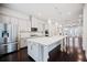 Stylish kitchen boasts stainless steel appliances, a spacious island, and pendant lighting at 1505 Slopeside Loop, Smyrna, GA 30082