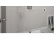 Laundry room with white walls, gray tile floors, and utility sink at 1505 Slopeside Loop, Smyrna, GA 30082
