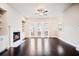 Spacious living room with hardwood floors, fireplace, and access to the outside at 1505 Slopeside Loop, Smyrna, GA 30082