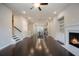 Expansive living area with hardwood floors, a fireplace, and open layout to the kitchen at 1505 Slopeside Loop, Smyrna, GA 30082