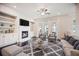 Comfortable living room with a fireplace, ceiling fan, and balcony access at 1505 Slopeside Loop, Smyrna, GA 30082