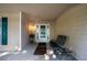 Cozy front porch with neutral siding and a charming spot to sit and relax at 5832 Sycamore Ridge Dr, Sugar Hill, GA 30518