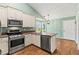 Well-equipped kitchen with stainless steel appliances, granite countertops, and ample cabinet space at 5832 Sycamore Ridge Dr, Sugar Hill, GA 30518