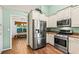 Gourmet kitchen features stainless steel appliances, ample storage, and a convenient layout at 5832 Sycamore Ridge Dr, Sugar Hill, GA 30518