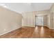 Expansive living room with wood flooring, neutral walls, and a welcoming atmosphere at 5832 Sycamore Ridge Dr, Sugar Hill, GA 30518
