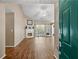 Bright living room featuring wood floors, a fireplace, and doors leading to the exterior at 5832 Sycamore Ridge Dr, Sugar Hill, GA 30518