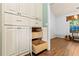 Built-in pantry with ample shelving and storage; natural wood drawers are visible at 5832 Sycamore Ridge Dr, Sugar Hill, GA 30518