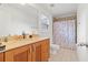 Bathroom with tan countertops, modern sink and fixtures, and tile flooring at 7535 Antique Barn Ave, Cumming, GA 30041