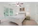 Bedroom with a large window and natural light at 7535 Antique Barn Ave, Cumming, GA 30041