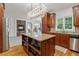Gourmet kitchen featuring a granite island, stainless steel appliances, and a decorative chandelier at 7535 Antique Barn Ave, Cumming, GA 30041