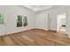 Spacious room with hardwood floors, large window, and glass panel door at 7535 Antique Barn Ave, Cumming, GA 30041