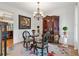 Sitting room with hardwood floors, chandelier, and exquisite display cabinet at 7535 Antique Barn Ave, Cumming, GA 30041