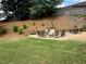 Expansive backyard featuring a stone patio, comfortable seating and a grassy area at 112 Countryside Ct, Woodstock, GA 30189