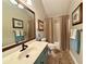 Bathroom features a vanity, framed mirror, decorative paint, shower, and towel racks at 112 Countryside Ct, Woodstock, GA 30189