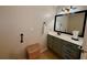 Bathroom features a vanity with storage, a mirror, and a towel rack at 112 Countryside Ct, Woodstock, GA 30189
