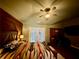 Charming bedroom with wood accent wall, and dedicated workstation at 112 Countryside Ct, Woodstock, GA 30189