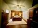 Comfortable bedroom features wood accent wall, ceiling fan, and ample storage at 112 Countryside Ct, Woodstock, GA 30189