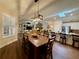 Open-concept dining area with skylight that flows into kitchen and living spaces at 112 Countryside Ct, Woodstock, GA 30189