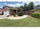 Charming brick home with a two-car garage, tidy landscaping, and welcoming curb appeal at 112 Countryside Ct, Woodstock, GA 30189
