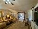 Bright, open-concept living room features a view of the backyard and dining area at 112 Countryside Ct, Woodstock, GA 30189
