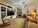 Comfortable living room boasts a stone fireplace, built-in shelves, and plush seating at 112 Countryside Ct, Woodstock, GA 30189